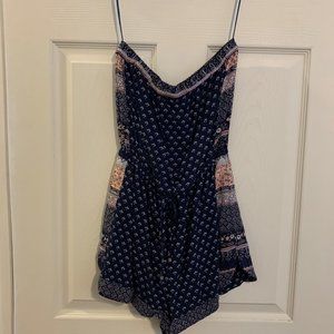 navy romper with light pink, patterned, sleeveless